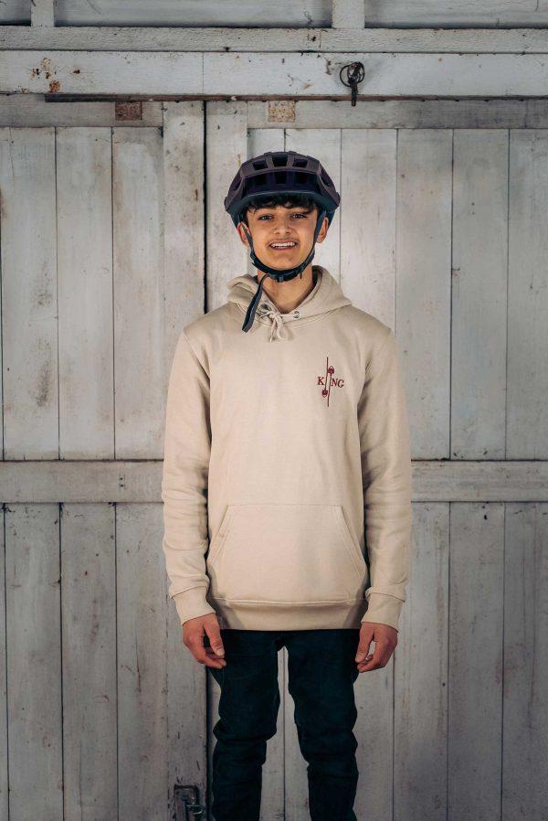 Boy's wearing King of Spades hoodie in oatmeal colour.